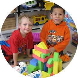 Two boys playing with blocks