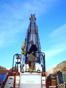 Man standing on a fire truck